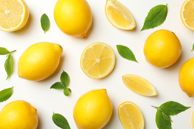Flat lay with lemons on light background. Fresh fruit