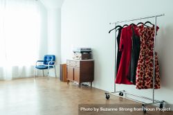 Clothing rack with vintage dresses in a bright loft space 4BJ6e4