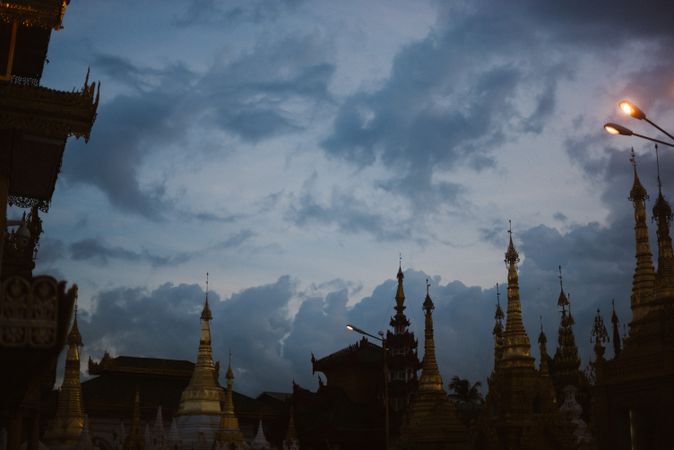 Beautiful old building with towers and cloudy heaven in evening