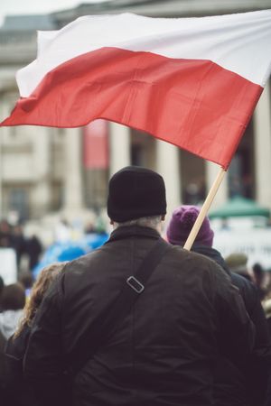London, England, United Kingdom - March 5 2022: Man with Polish flag in Trafalgar Square