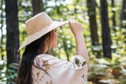 Young woman walking in the forest