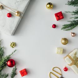 Christmas layout made of presents, branches, baubles on light background