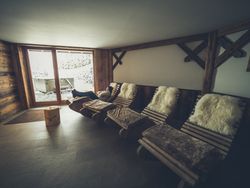 Female relaxing on rocking lounge chair