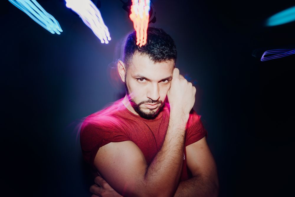 bearded man dancing in spotlight