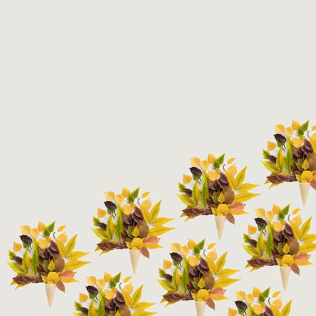 Pattern of cone of autumn leaves with copy space