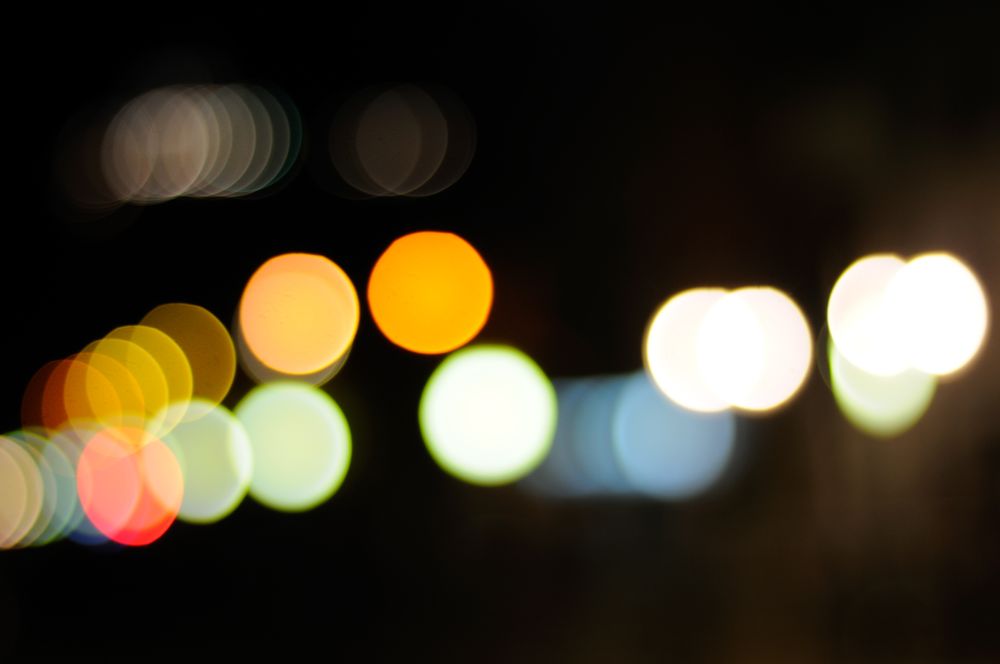 Blurry night lights along city street