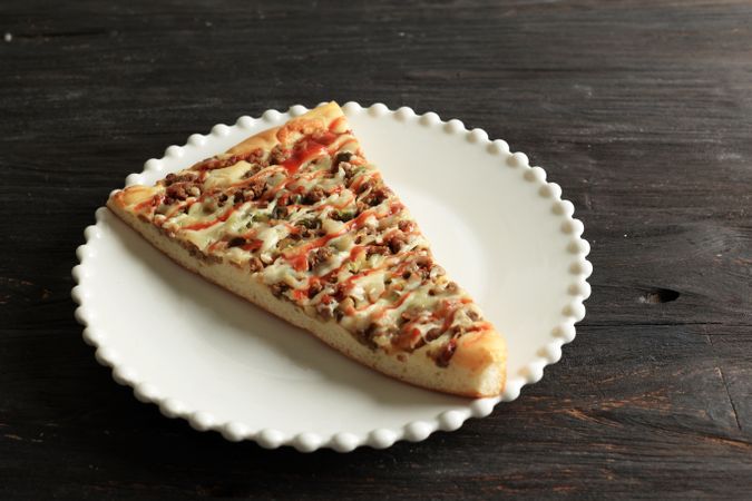 Close Up Big Slice Beef Pizza on Plate