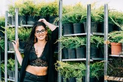 young female in greenhouse
