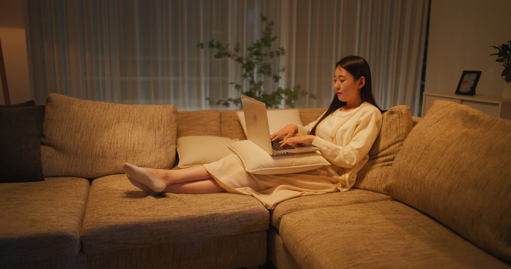 South Korean Woman Relaxing on a Cozy Couch