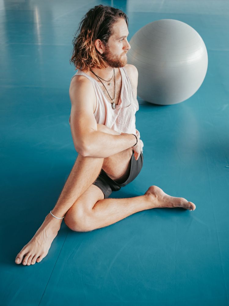 Male stretching in spacious room