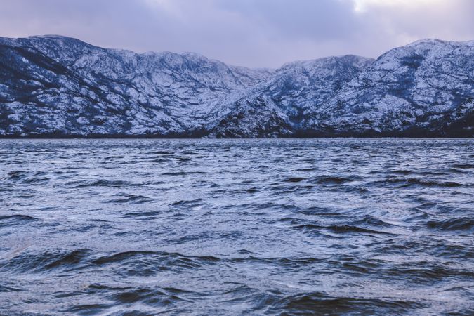 Shore with mountains near water