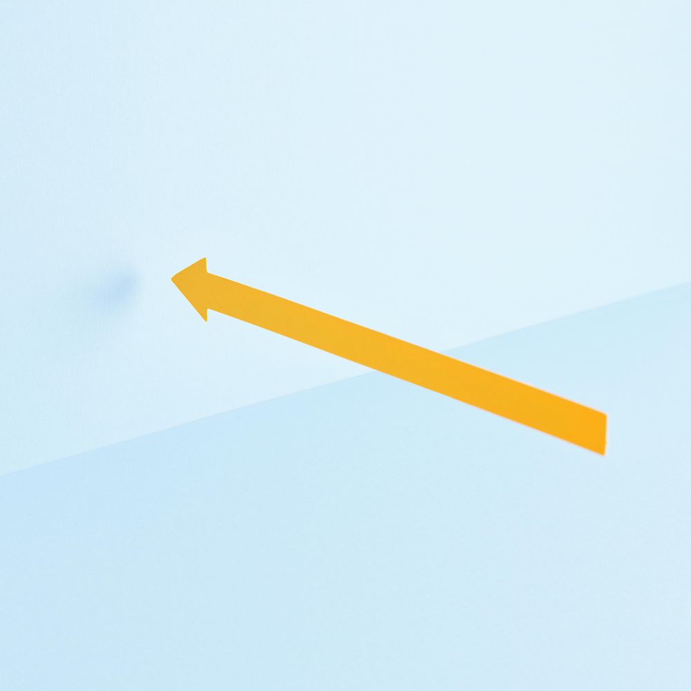 Yellow arrow pointing to the left over blue background