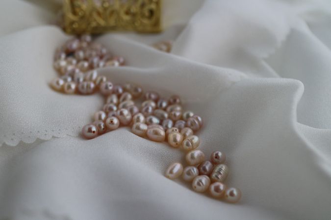 Close up of freshwater cultured pearls on satin silk