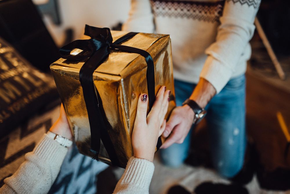 Man giving a gift to a woman