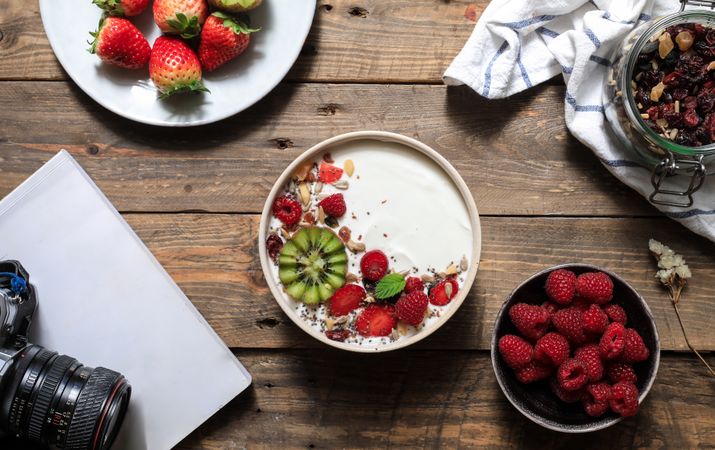 Creamy dessert with ripe strawberry and raspberry with kiwi