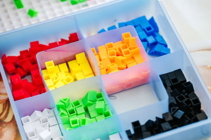 Box with colorful pieces for board game