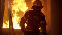 Fireman running up stairs