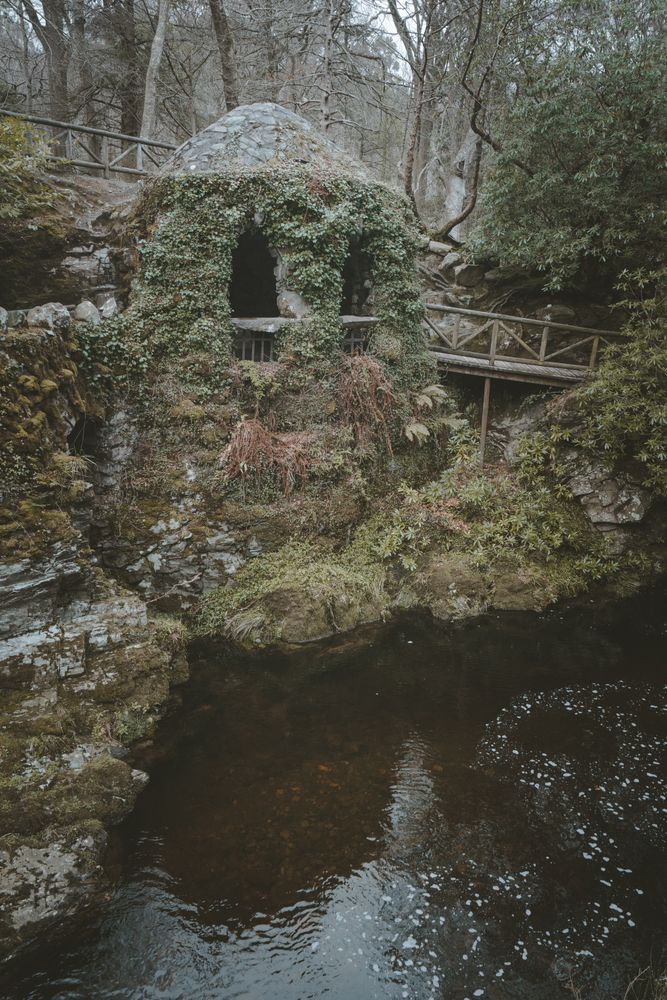 Stone shelter at riverside in Tollymore Forest Park