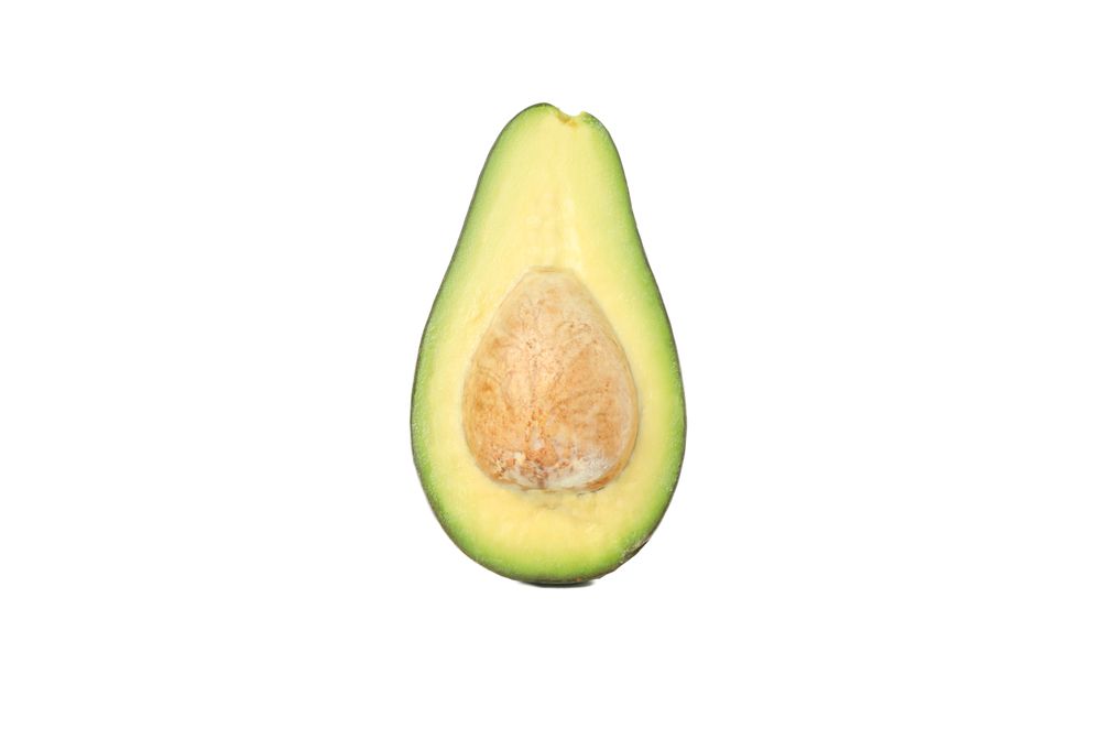 Half of ripe avocado isolated on blank background