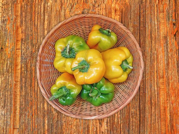 Peppers On The Wooden Background