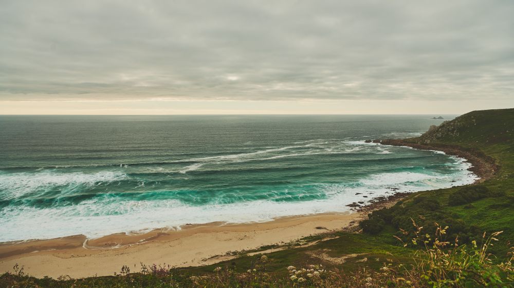 Wide shot of the Cornish coast on an overcast day