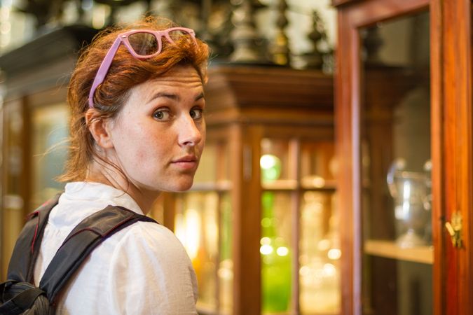 Female traveler in souvenir shop