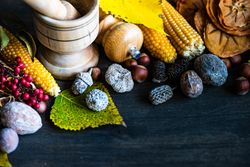 Seasonal autumn table with nuts, berries, vegetable and fruits