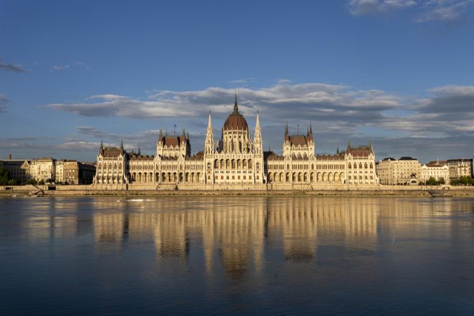 Blue sky and fluffy clouds over Hungarian Parliament building