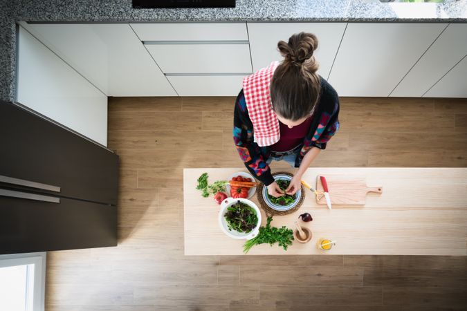 Woman preparing vegetable salad