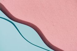 Pink sand and blue water beach scene