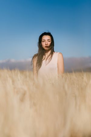 Female Model standing in field