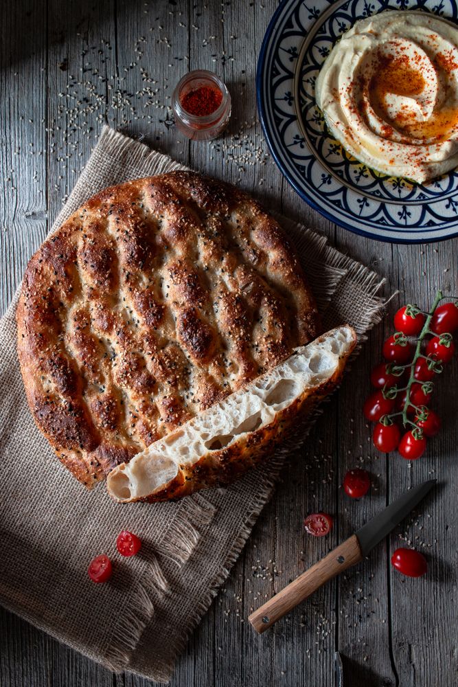 Ramazan pidesi near spices and tomatoes