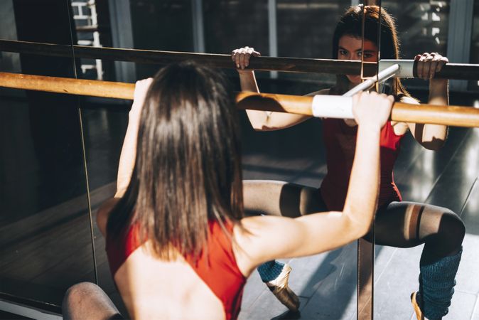 Concentrated dancer training with barre
