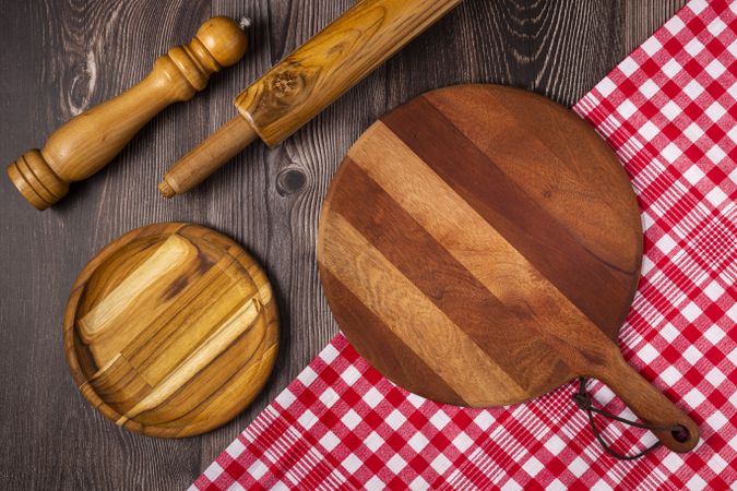 Empty pizza board on rustic wooden table. Top view image.