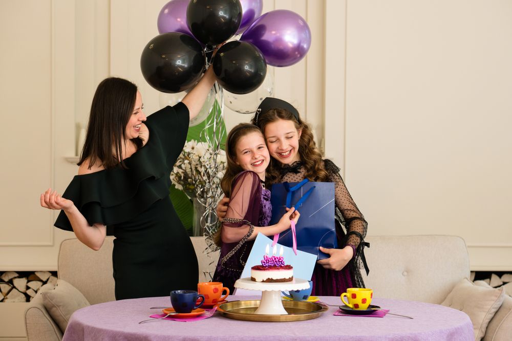 Mother and girls enjoying birthday