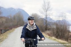 Woman smiling while riding a bicycle 4j6Xr4