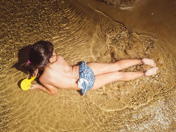 anonymous little girl by the seashore
