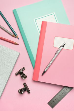 School stationery set on pink background
