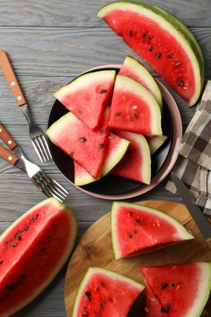 Composition with watermelon slices on gray wooden table. Summer fruit