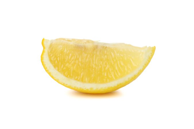 Lemon slice isolated on light background. Ripe fruit
