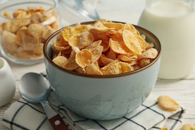 Concept of breakfast with muesli and milk on wooden table