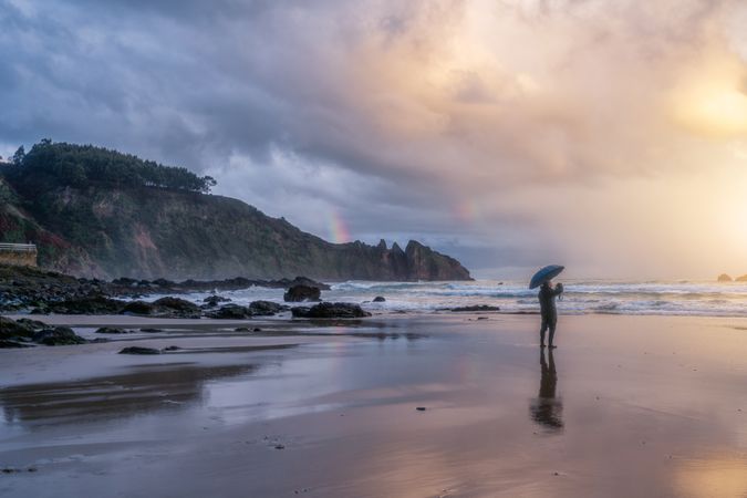 Man watching sunset on beach