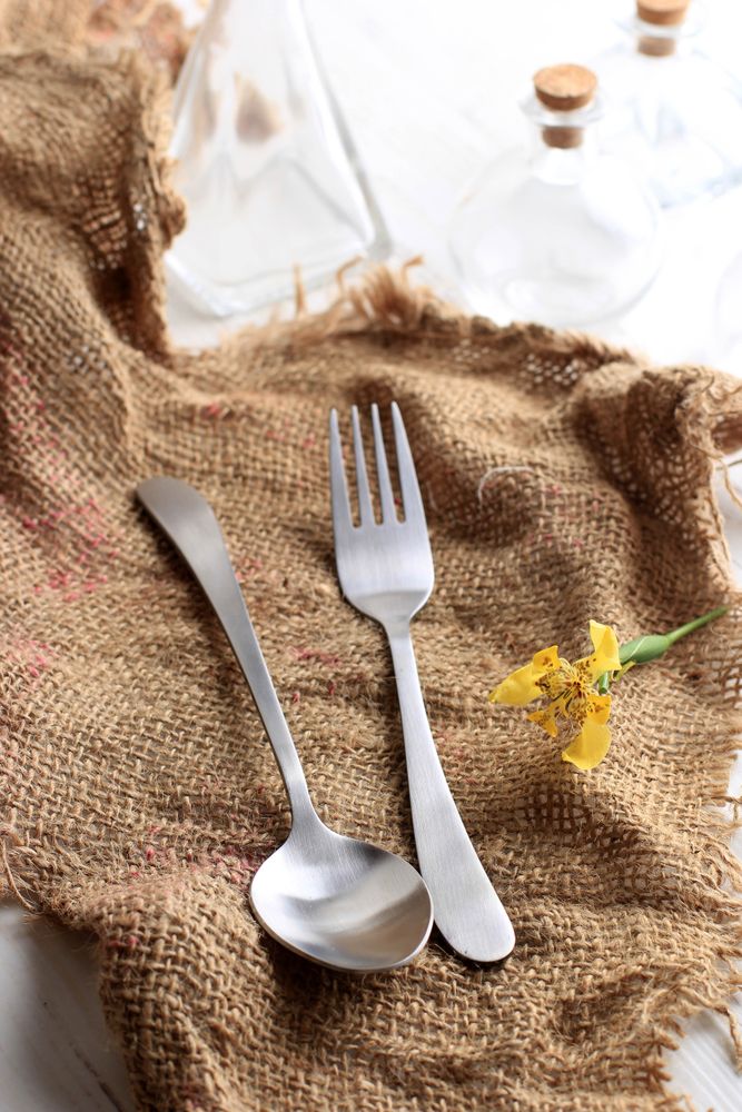 Stainless Spoon and Fork on Jute Napkin