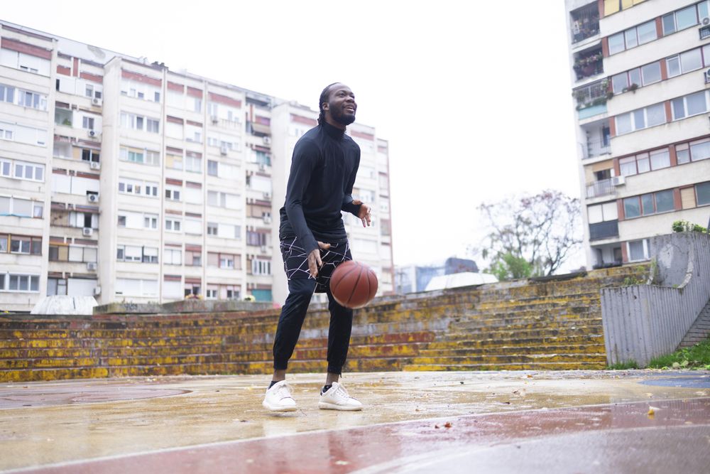 Young Black Man Playing Basketball.