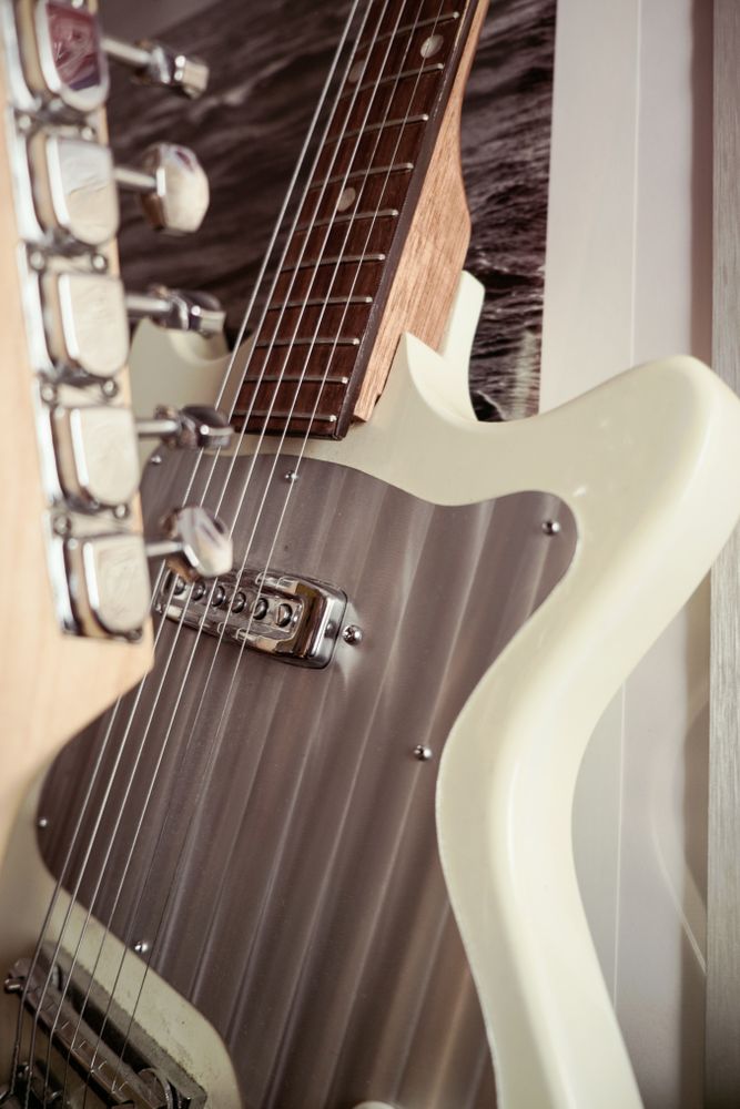 Close up of bridge and strings of guitar