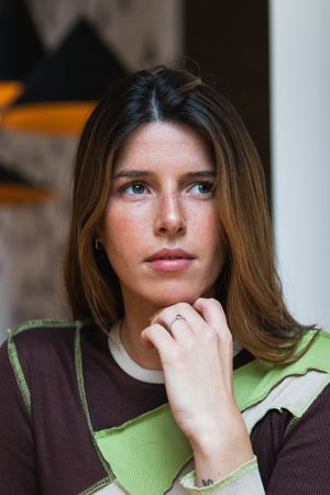 Gentle pensive woman looking away