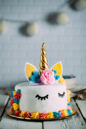 Cute unicorn cake with painted closed eyes