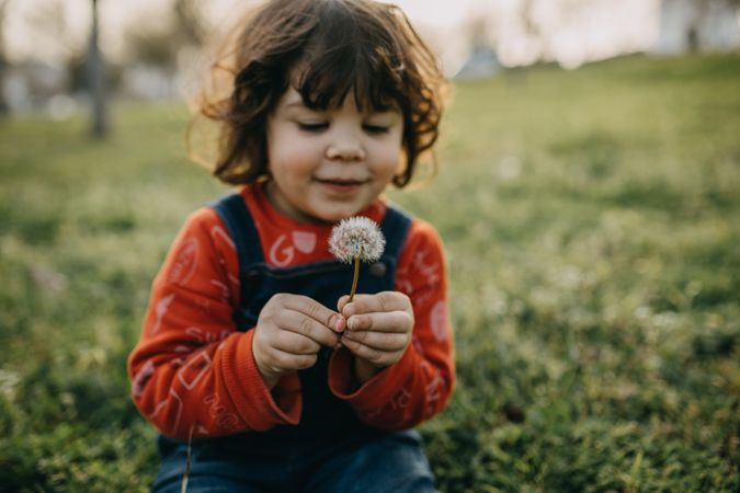 Child with dandelion