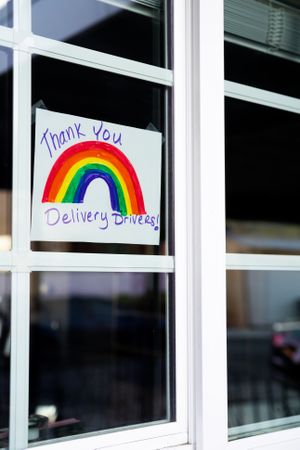 Angled view of window with sign thanking delivery drivers