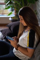 Woman using smartphone at home
